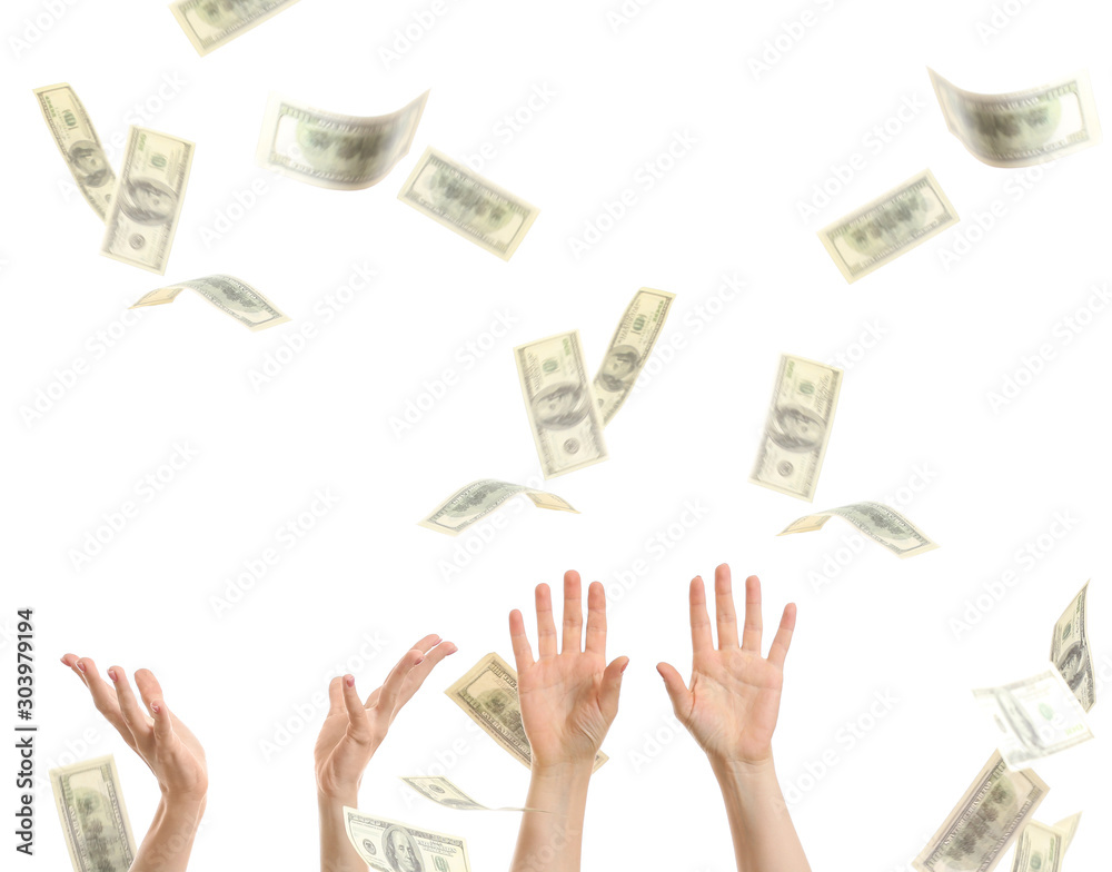 Female hands with falling dollar banknotes on white background