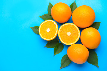 Fresh oranges on color background