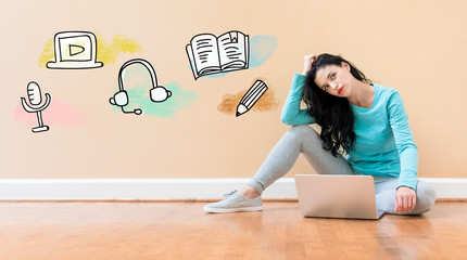 Wall Mural - E-Learning concept with young woman using a laptop computer