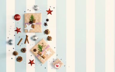  Handmade Christmas gift boxes with ornaments - flat lay