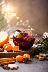 Christmas mulled wine  delicious holiday like parties with orange cinnamon star anise spices. Traditional hot drink in circle glasses or beverage, festive cocktail at X-mas or New Year