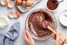 Close Up Of Female Hands Mixing Ingredients In Bowl. Baking Chocolate Cake