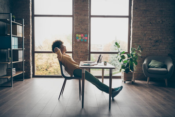 Wall Mural - Profile side full body photo of peaceful joyful afro american girl freelancer finish her start-up project sit table dream stretch hands in loft office