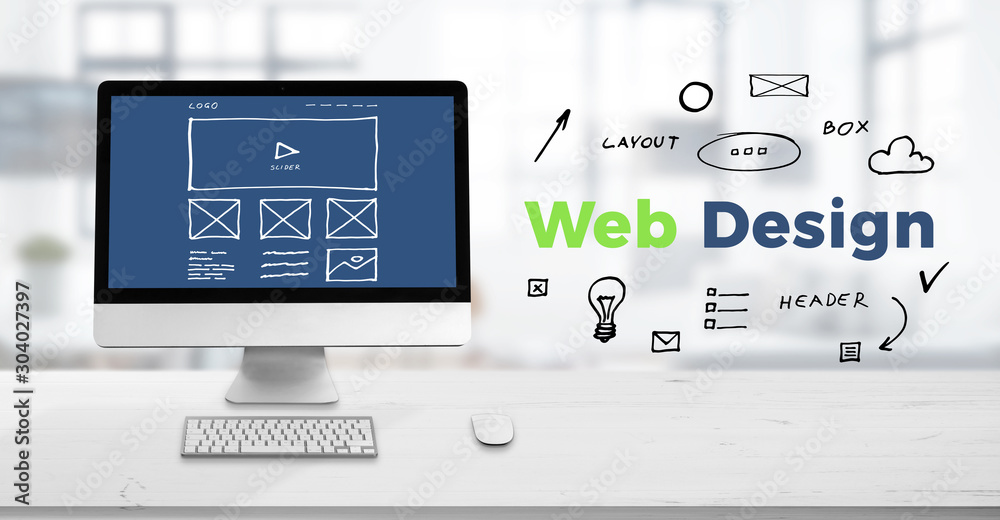 Web design studio concept with computer display on work desk and web design text surrounded with sketch web page elements. - obrazy, fototapety, plakaty 