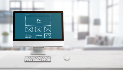 Poster - Web site sketch on computer display. Concept of web design studio. Copy space beside for promo text.