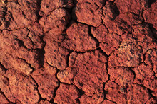 Red Earth Cracked From Drought And Pollution