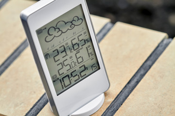 Wall Mural - Best personal weather station device with weather conditions inside and outside. Home digital weather forecast concept with temperature and humidity.