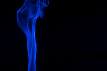 Blue smoke on black background