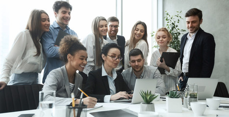 Poster - Happy business team analyzing data on laptop together