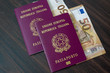 © Nora - Passports, travel documents. Italian passport of the European Union and 50 euro banknotes. Travel preparations.