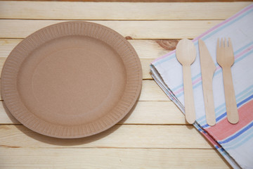 Eco paper plate fork on old wooden table