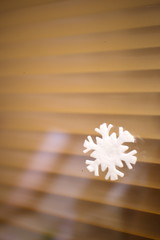 white snowflake paper decoration on glass