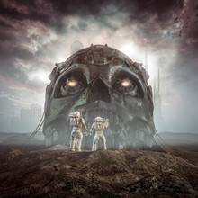 Giants Of Yesterday / 3D Illustration Of Science Fiction Scene Showing Astronauts Discovering Ancient Giant Robot Skull In The Desert Outside Alien City