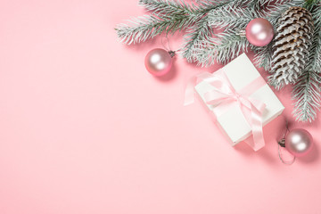 Wall Mural - Christmas flat lay background with christmas present box on pink.