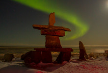 Northern Lights And Inukshuk