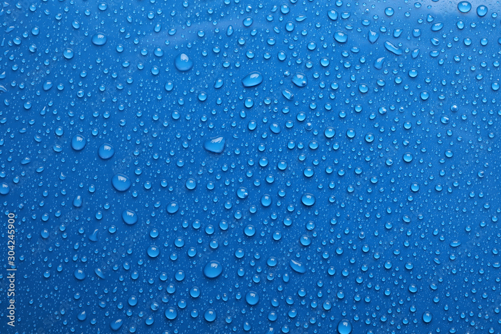 Water drops on blue background, top view - obrazy, fototapety, plakaty 