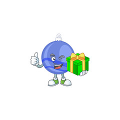 Canvas Print - Shiny blue christmas ball cartoon with character holding gift