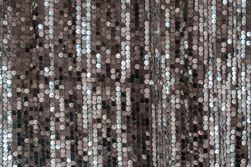 uniform silver fabric background with shiny sequins