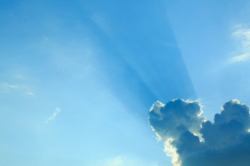 sun light shine through cloud on clear blue sky background