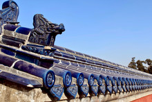 Chinese Ancient Ceramic Blue Roof Tiles. Traditional Pattern With Dragons. The Temple Roof Against The Blue Sky. Temple Of Heaven, Beijing. Asian Architectural Background