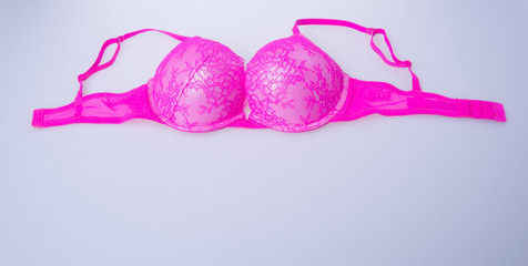 Wall Mural - bra or pink colour bra on white background.