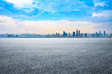 Wall Mural - Sunset empty asphalt road and city skyline in Chongqing