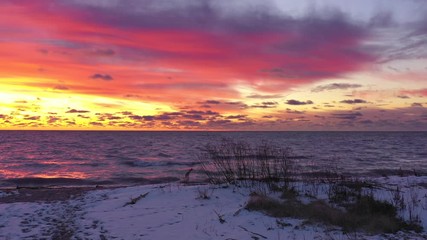 Wall Mural - Dramatic twilight sky over Lake with cold waves dashing upon the shore.