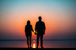 © Artem - The couple against the beautiful sunset sky