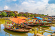 Wooden boats on the Thu Bon River in Hoi An , Vietnam
