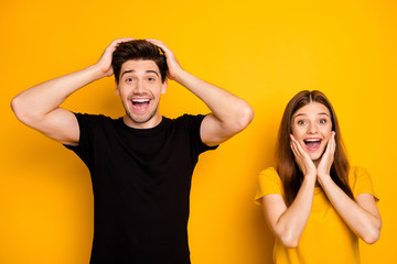 Photo of cheerful positive cute charming pretty couple rejoicing about seeing nice new information wearing black brunet t-shirt isolated over bright shiny color background