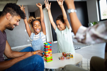 Happy black family having fun times at home