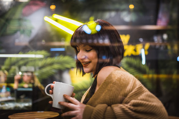 View of Cute young girl through window glass