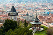 View at Graz City from Schlossberg hill, City rooftops, Mur river and city center, clock tower.