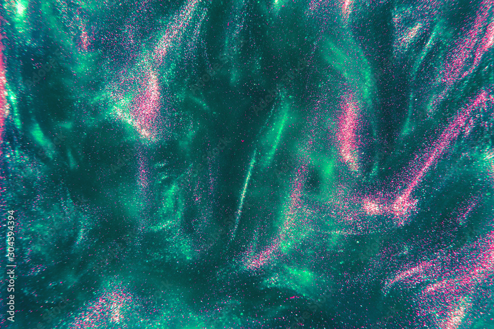 Abstract elegant, trendy detailed mint and pink glitter particles flow with shallow depth of field underwater. Holiday magic shimmering luxury background. Festive sparkles and lights. de-focused. - obrazy, fototapety, plakaty 