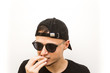 © Павло Кукуруза - emotion eating, young man in black cap and black glasses on a white background, people emoji