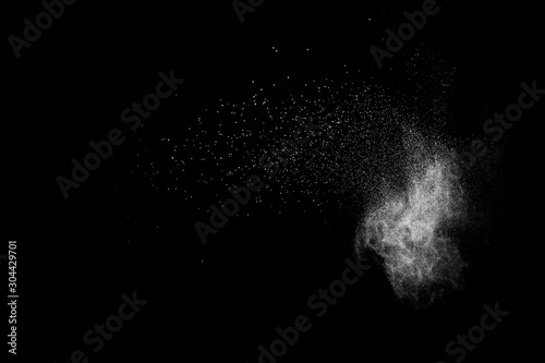 Cuadros en Lienzo White powder explosion cloud against black background