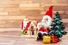Santa Claus Figurine Christmas Decoration Over Wooden Background