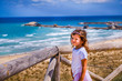 cute sweet nice smart look brat little girl baby wink with colorful summer seascape background