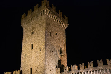 Tower of a castle in Italy illuminated at night