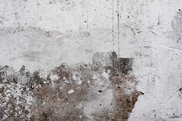 Texture of a concrete wall with cracks and scratches which can be used as a background