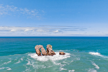 Wall Mural - Lonely rock formations in the ocean