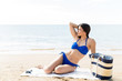 © AntonioDiaz - Woman In Blue Swimsuit Resting At Beach