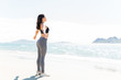 © AntonioDiaz - Female Athlete Relaxing At Beach
