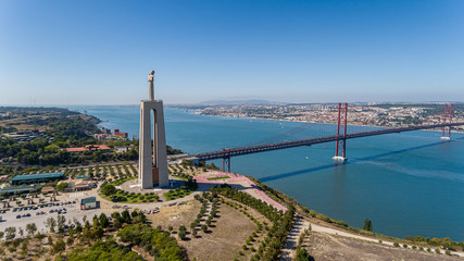 Canvas Print - Aerial. Panorama from sky, a 25 de Abril Bridge and a statue of Jesus Christ. Lisbon.