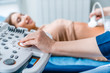© InsideCreativeHouse - Doctor ultrasound examine female patient at hospital