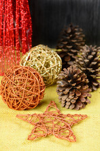 Christmas Ornaments On Table With Yellow Jute Fabric