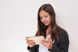 © VSenturk - Young girl has the tablet in hand, she is looking at the tablet,