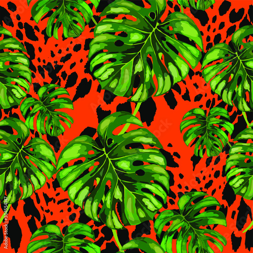 Seamless pattern with tropical leaves on cheetah spots. Beautiful allover pri...