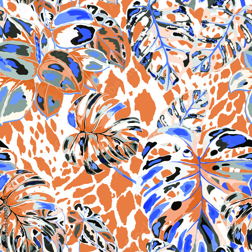 Seamless pattern with tropical leaves on cheetah spots. Beautiful allover pri...