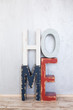 © Olga Mishyna - The word 'home' from wooden letters on grey background
